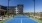 a tennis court in front of a building
