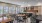 a kitchen with tables and chairs
