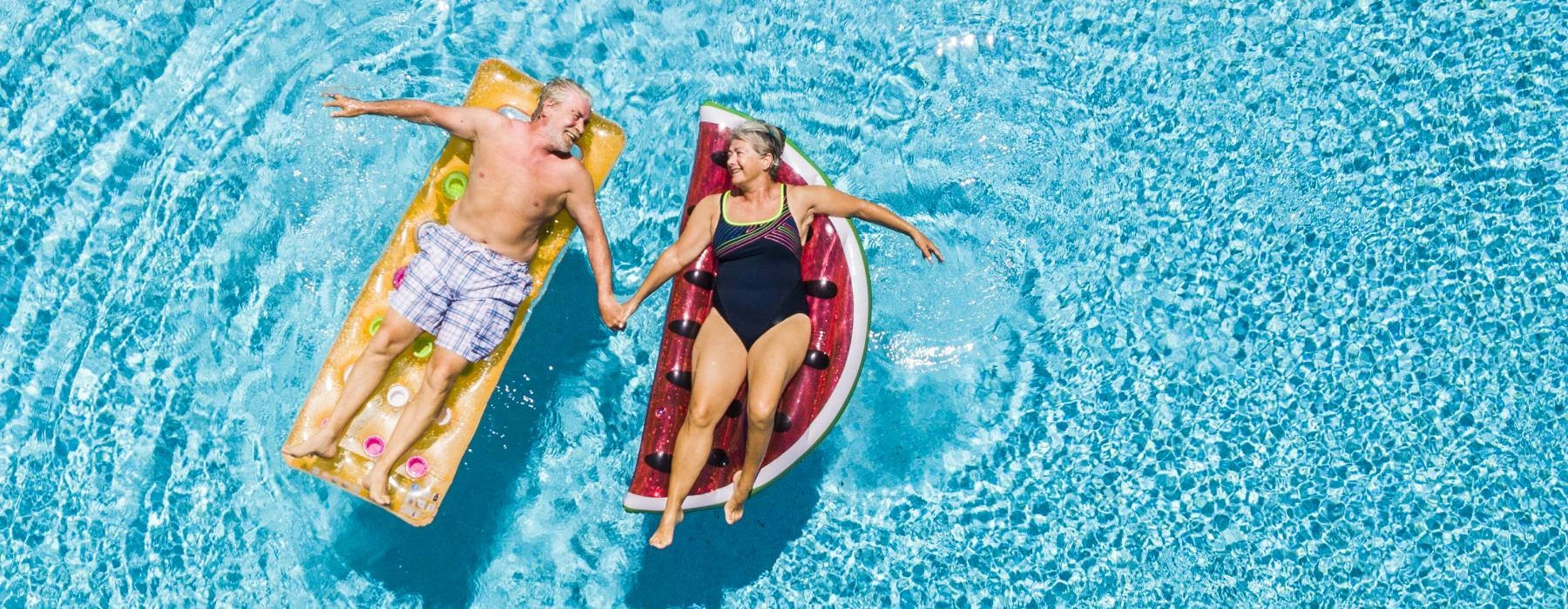 a couple of people in swimsuits in the water