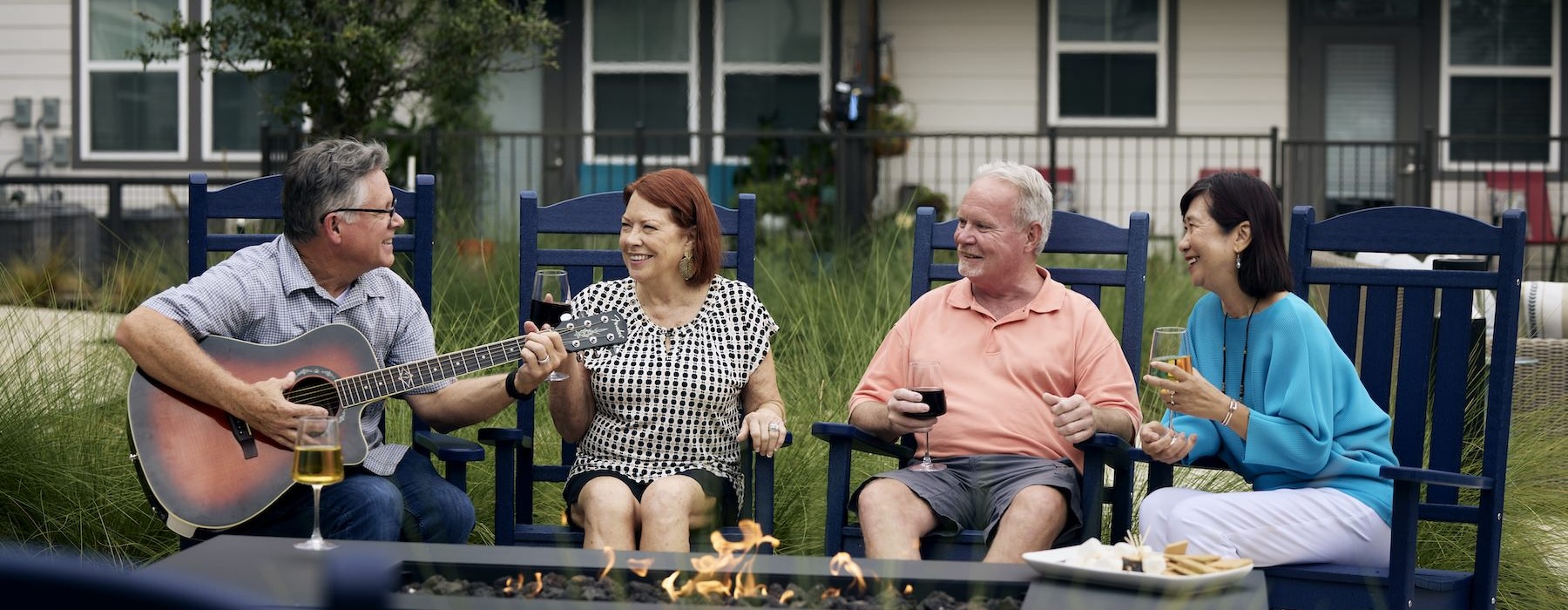 a group of people sitting down and playing music