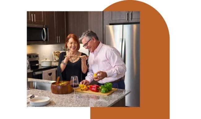 Settle into comfort at Amberlin Georgetown a man and a woman in a kitchen